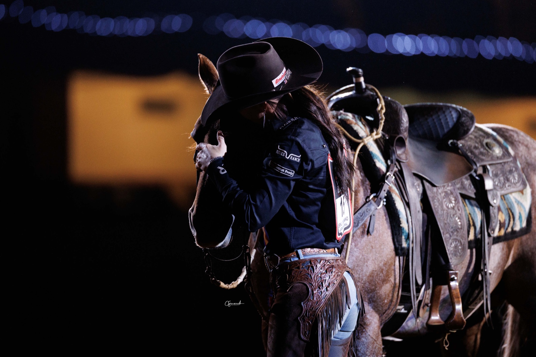 Erin Taormino kissing Hazardouz Material's face after winning the World's Greatest Horseman