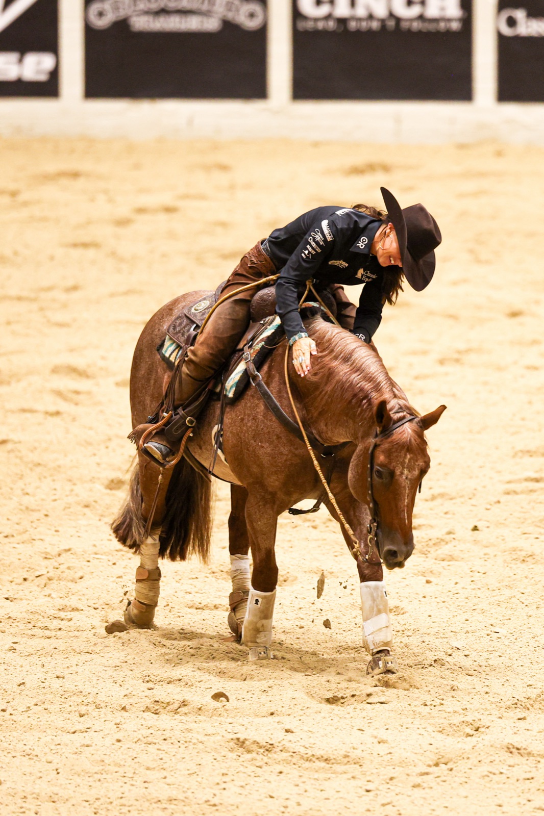Erin Taormino patting Hazardouz Material's neck after winning The Run For A Million Cow Horse Challenge